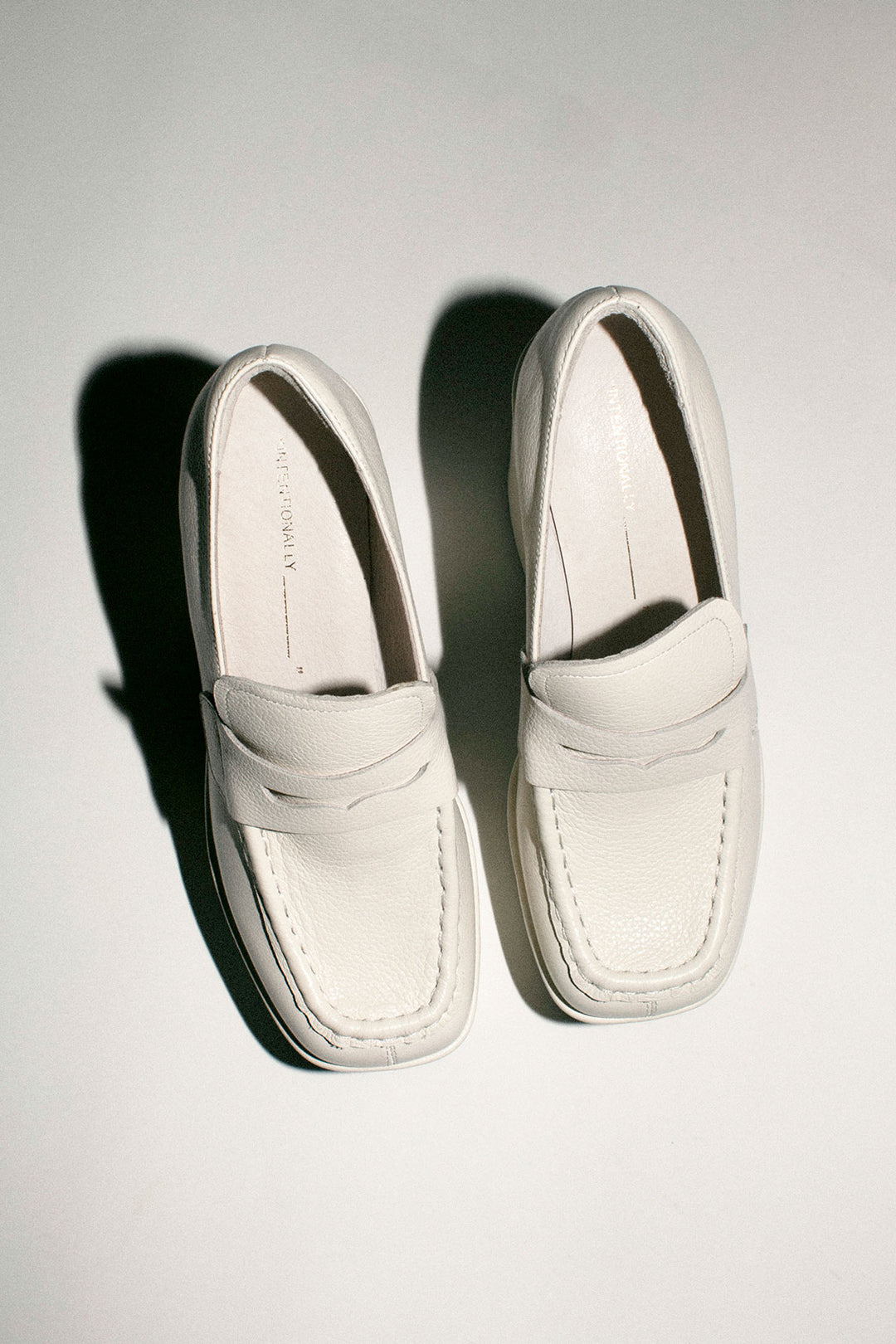 White leather loafers by Blondo with black sole and platformed heel y2k footwear Amazon.com | Women main image 2