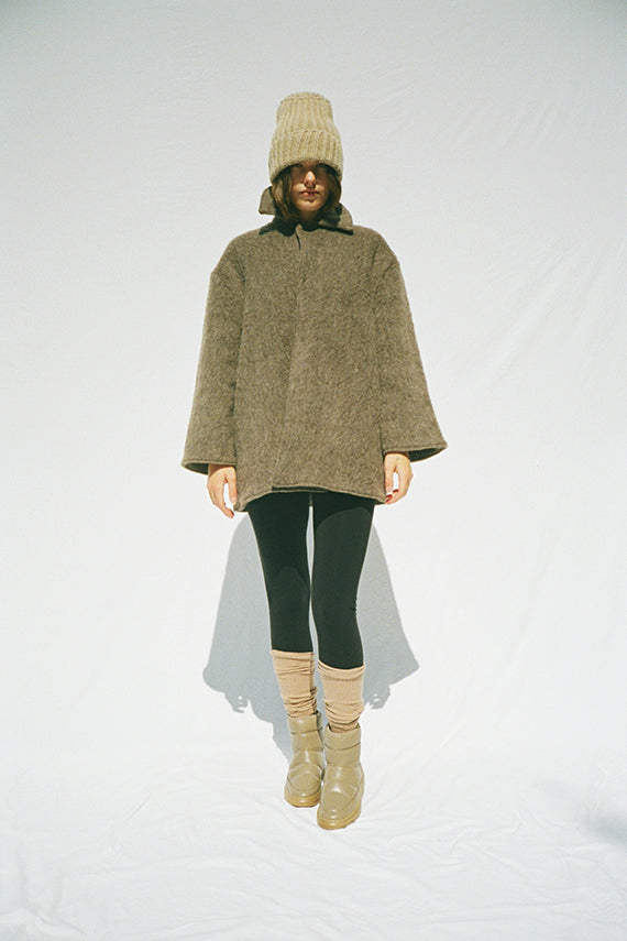 By Far moon boots and Baserange coat