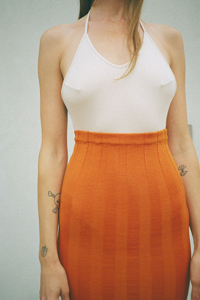 Baserange bodysuit and ocra orange adler skirt