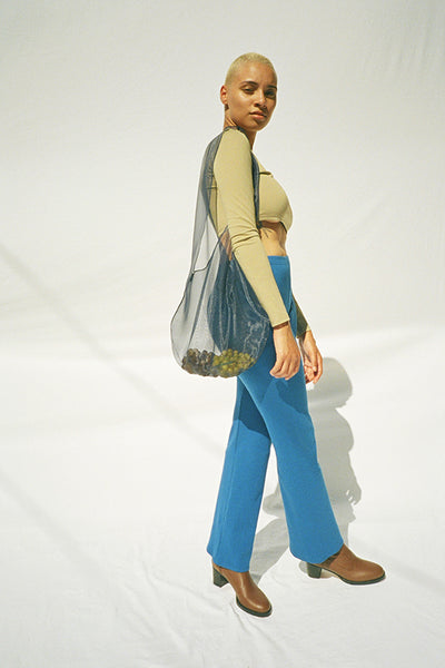 Maryam Nassir Zadeh clothing, full outfit with crop top, dance pants, boots and sidra tote