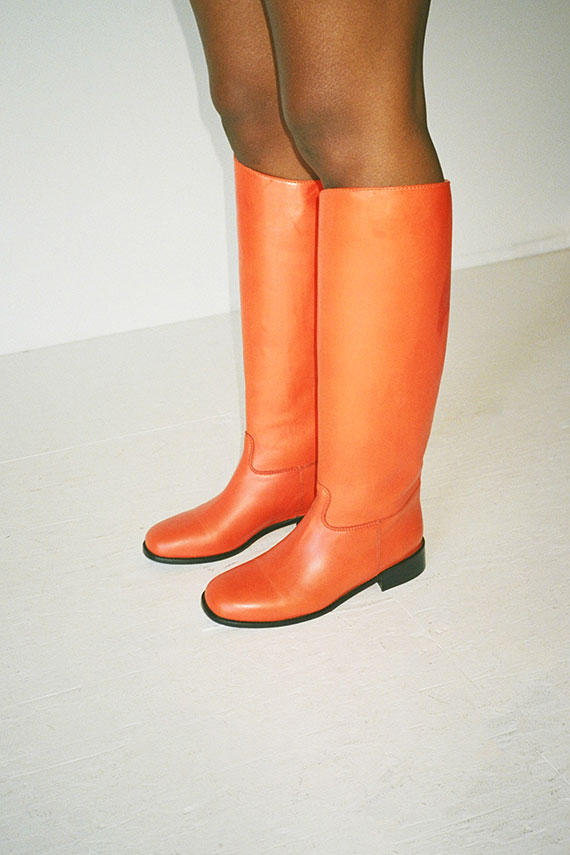 MNZ boots in bright orange with a rounded toes and seamed details