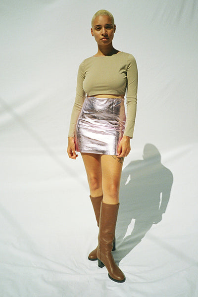 Maryam Nassir Zadeh knee high boots, leather miniskirt and long sleeve crop top