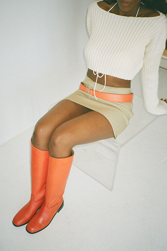 Orange MNZ knee high boots and miniskirt